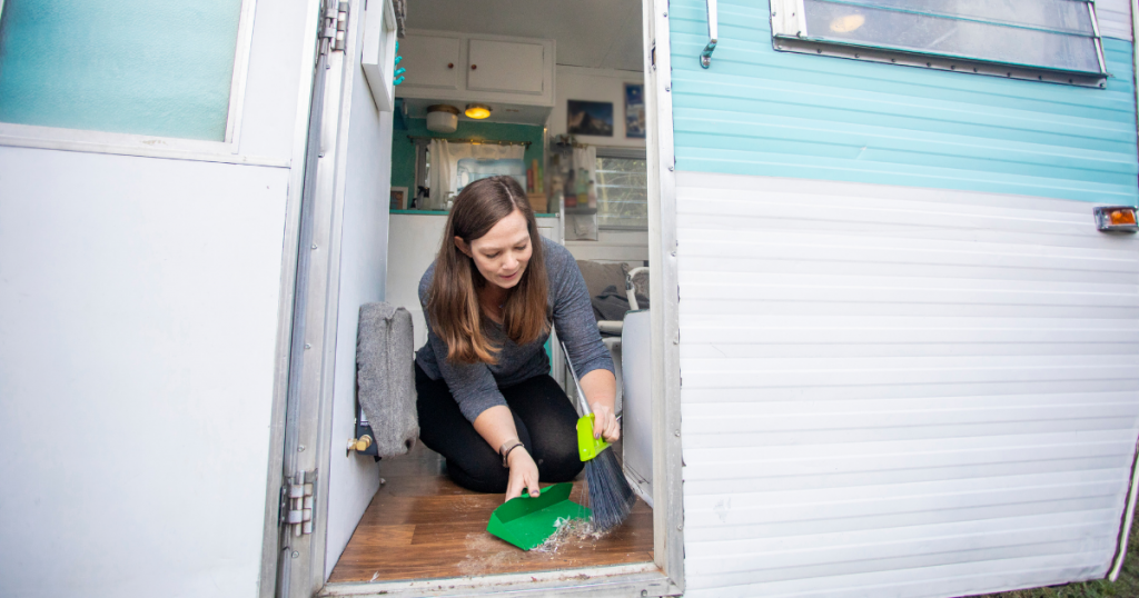 woman sweeping rv